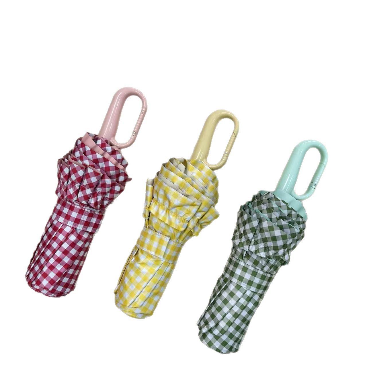 Red, yellow, orange, and green plaid lace folding umbrellas with ring handles